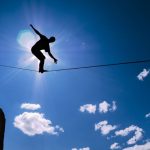 45288086 – silhouette of man on the rope concept of risk taking and challenge