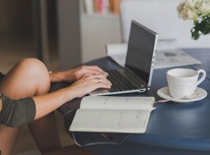 Woman's hands using laptop